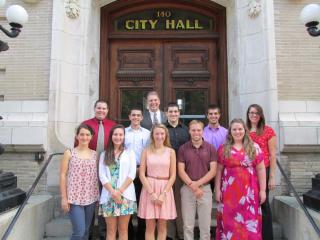 Mayor Vigeant and a group of former Public Service Internship Program students.
